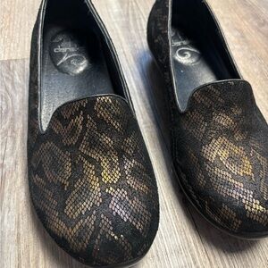 Dansko Olivia Black and Gold Snake Patterned Loafers